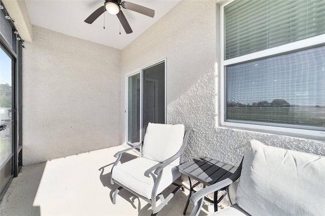 view of patio featuring ceiling fan