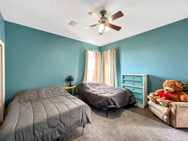 bedroom featuring lofted ceiling, carpet, a textured ceiling, and ceiling fan