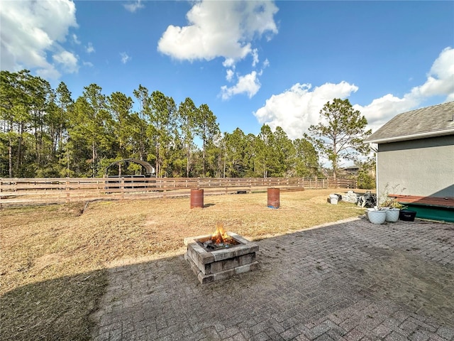 view of yard with a patio and a fire pit