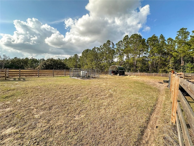 view of yard with a rural view