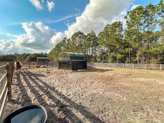 view of yard with a rural view