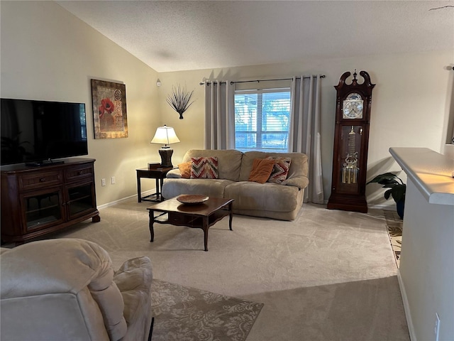 living room with vaulted ceiling, light carpet, and a textured ceiling