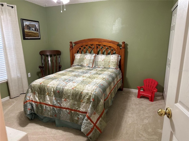 bedroom with light carpet