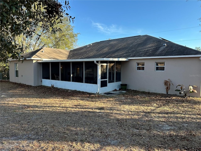 back of house with a sunroom