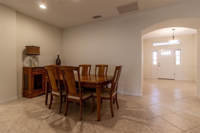 dining space with light tile patterned floors