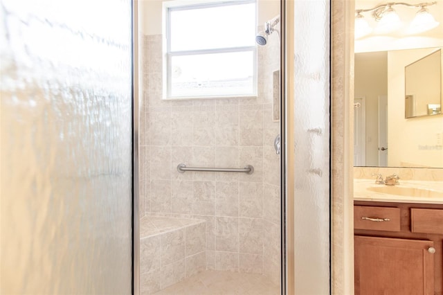 bathroom with vanity and an enclosed shower