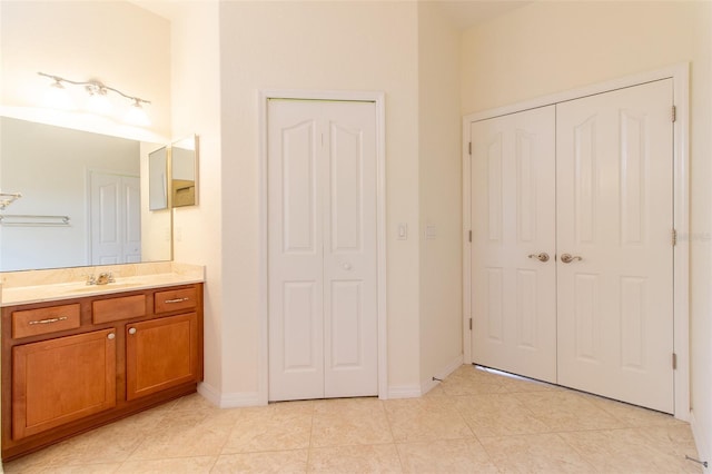 bathroom with tile patterned floors and vanity