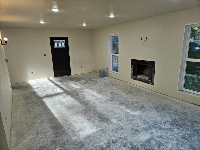 unfurnished living room with a fireplace