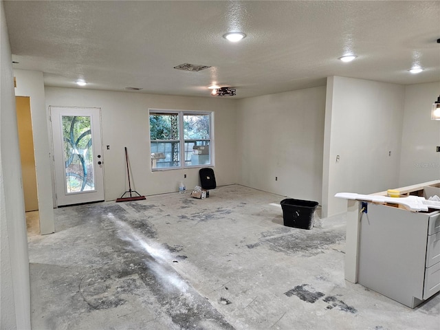 interior space featuring a textured ceiling