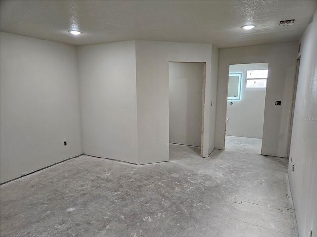 empty room with a textured ceiling