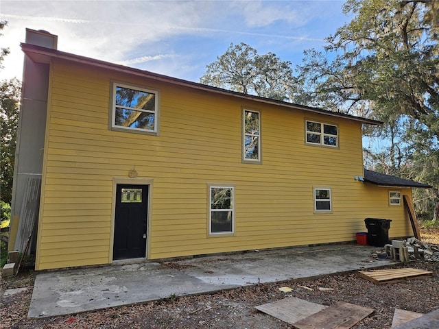 back of property featuring a patio area