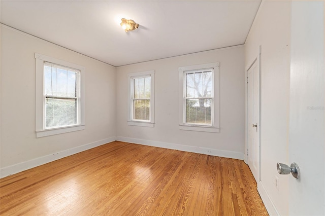 empty room with wood-type flooring