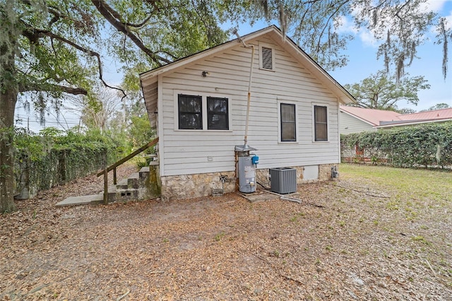 rear view of property with central air condition unit