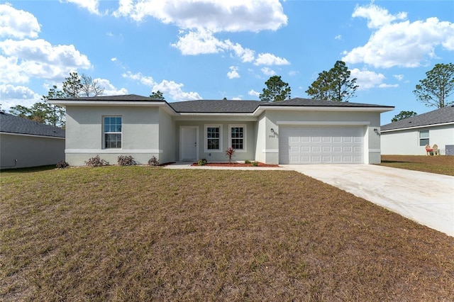 view of front of property with a garage and a front lawn