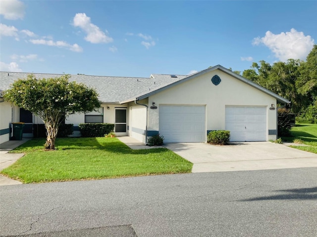 ranch-style home with a garage and a front yard