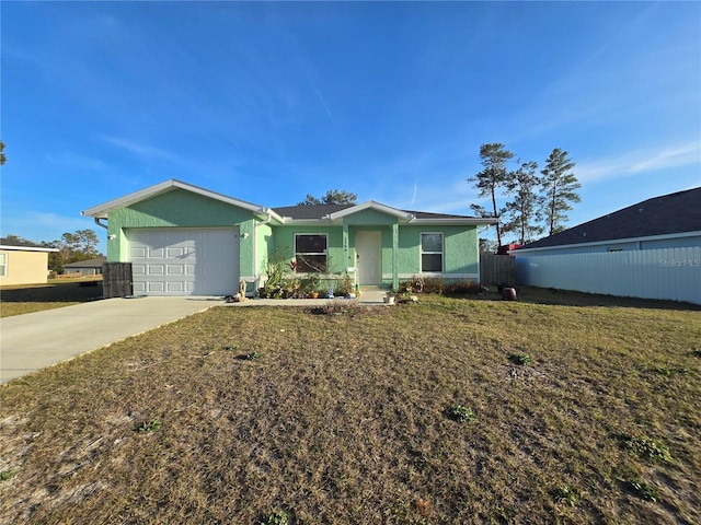 ranch-style home with a garage and a front yard