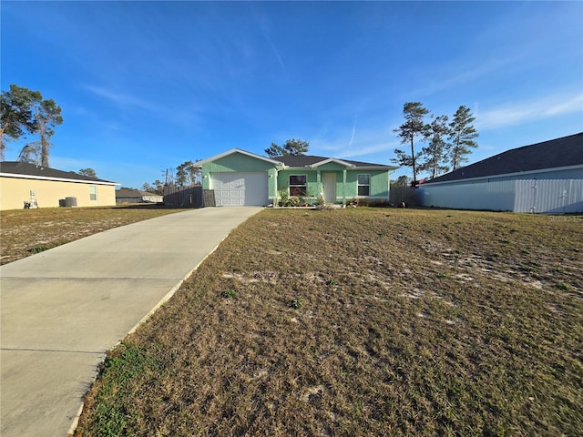 ranch-style home with a garage and a front lawn