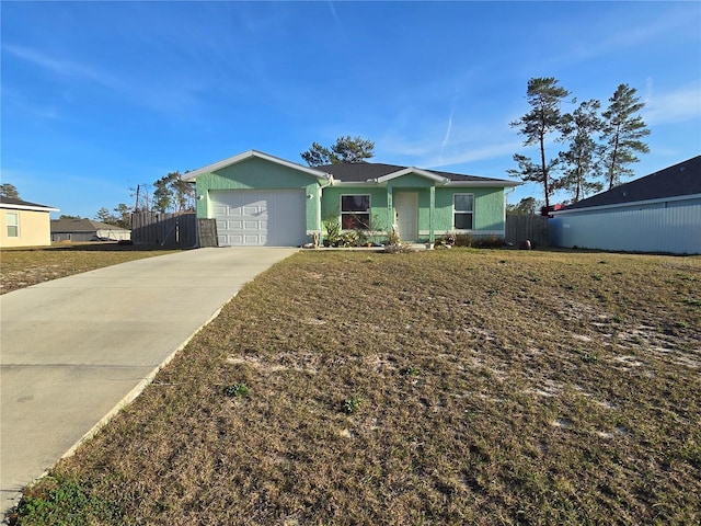 single story home with a garage and a front lawn