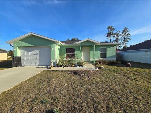 ranch-style home with a garage and a front yard