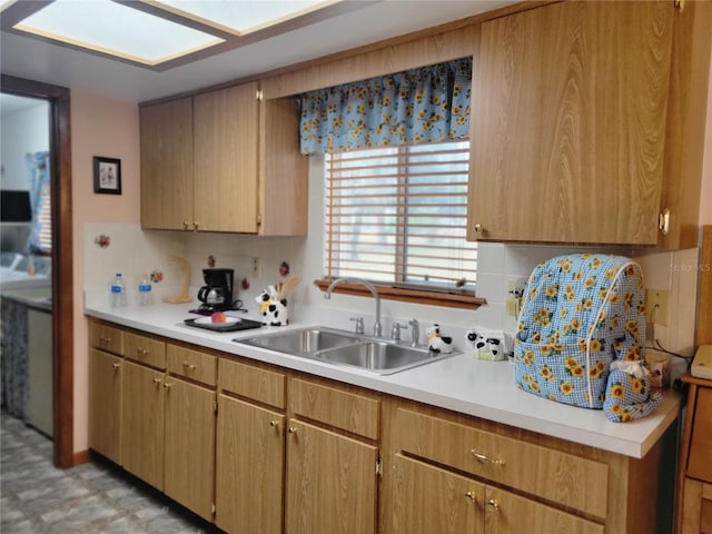 kitchen featuring sink and backsplash