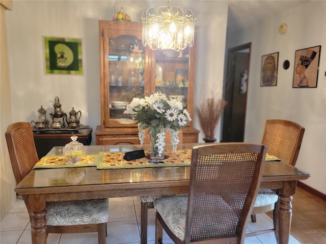 dining space featuring a notable chandelier