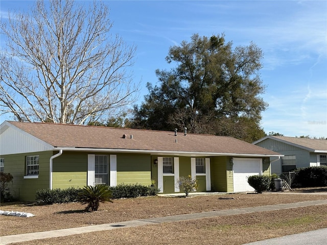 ranch-style house featuring a garage