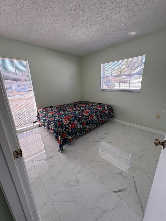 bedroom with a textured ceiling