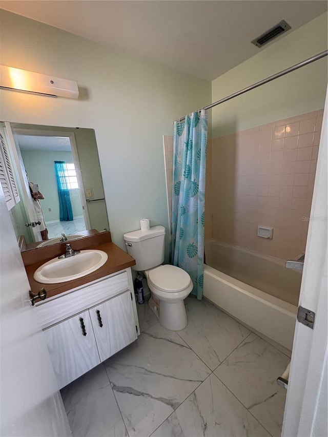 full bathroom with shower / bath combo, vanity, and toilet