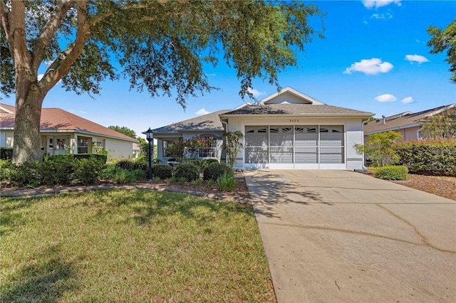 ranch-style home with a garage and a front yard