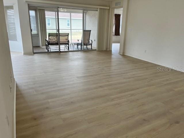 spare room featuring light hardwood / wood-style floors