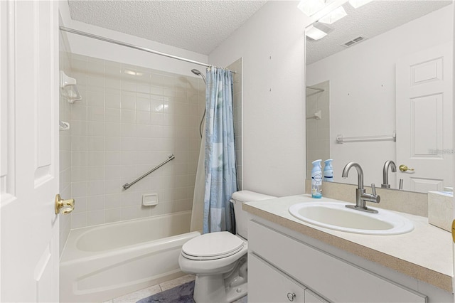 full bathroom featuring tile patterned flooring, shower / tub combo, vanity, a textured ceiling, and toilet