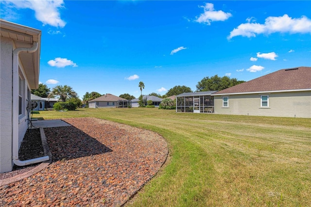 view of yard with a sunroom