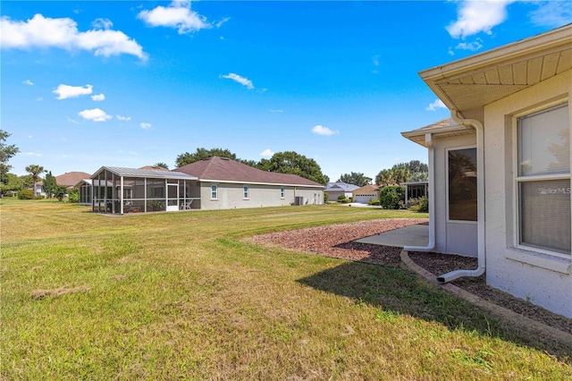 view of yard featuring a sunroom