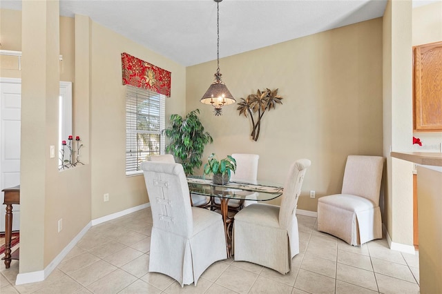 dining space featuring light tile patterned floors