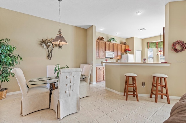 dining room featuring light tile patterned flooring