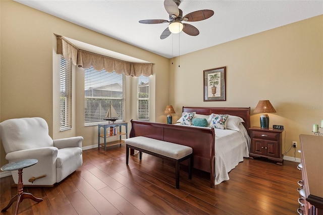 bedroom featuring dark hardwood / wood-style floors and ceiling fan