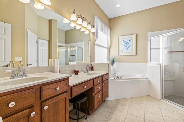 bathroom featuring tile patterned floors, shower with separate bathtub, and vanity