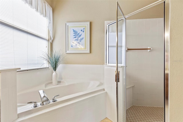 bathroom featuring plus walk in shower