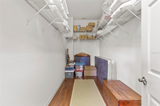 spacious closet with wood-type flooring