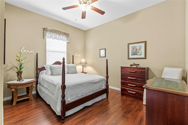 bedroom with dark hardwood / wood-style floors and ceiling fan