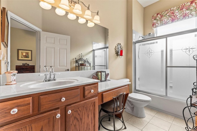 full bathroom with vanity, tile patterned floors, shower / bath combination with glass door, and toilet