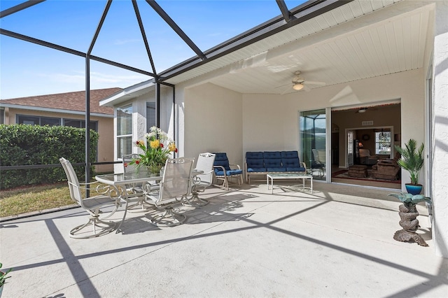 view of patio / terrace featuring outdoor lounge area, ceiling fan, and a lanai