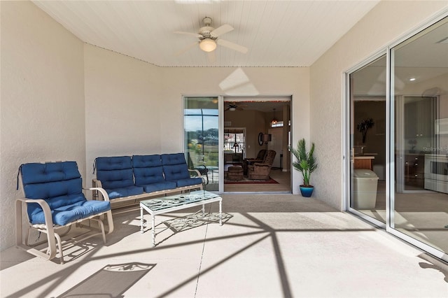 view of patio featuring an outdoor hangout area and ceiling fan