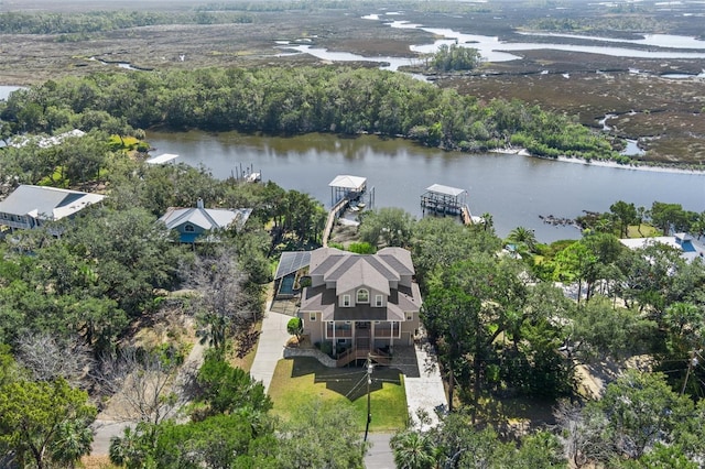 birds eye view of property with a water view