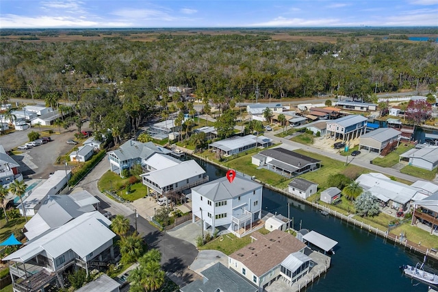 drone / aerial view featuring a water view and a residential view