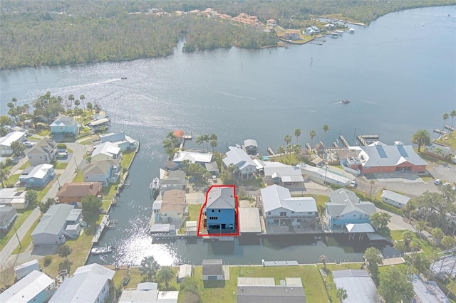 birds eye view of property with a water view and a residential view