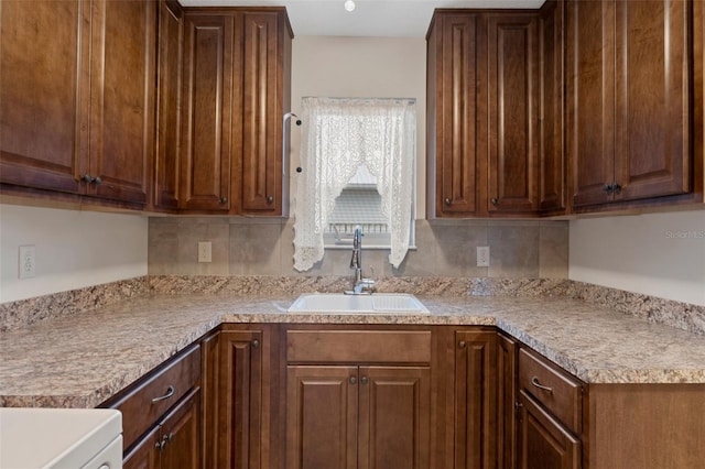 kitchen with light countertops and a sink