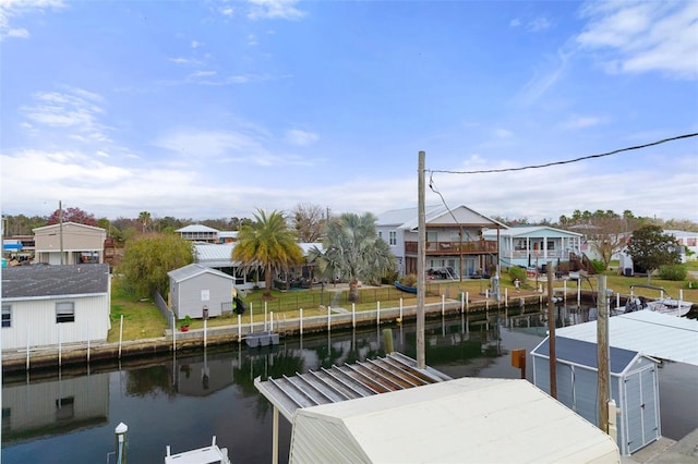 view of dock featuring a water view and a residential view