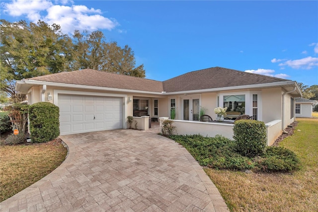 ranch-style home featuring a garage