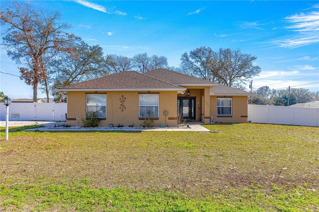 back of property featuring a yard